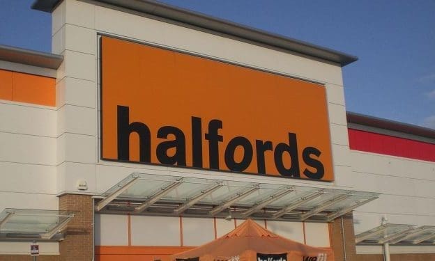 Halfords acquires garage chain amid profit plunge